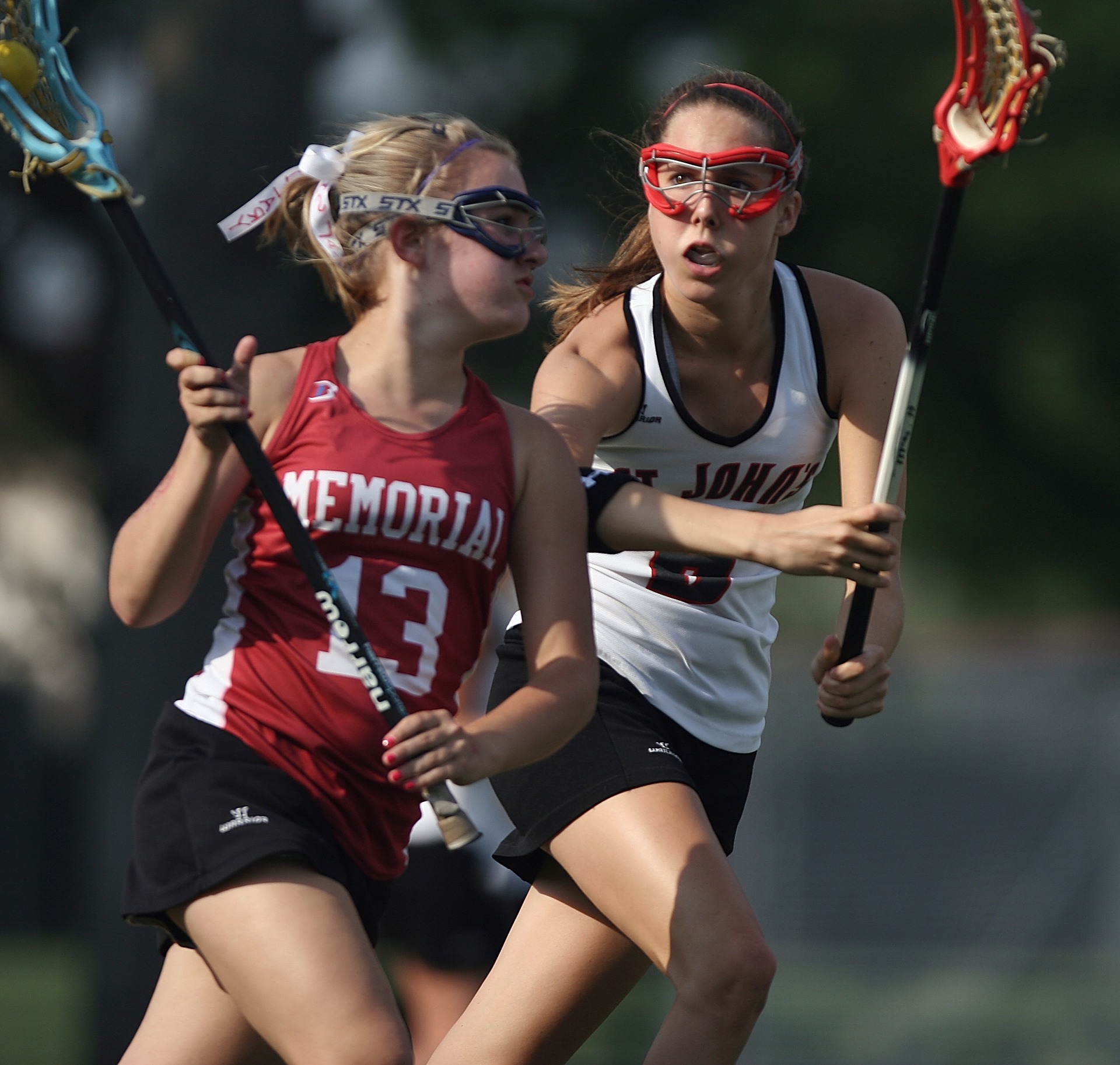 Lacrosse players battling for the ball